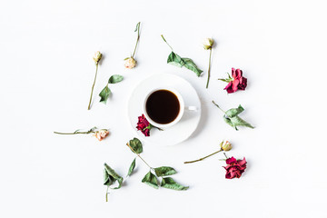 cup of coffee with dry rose flowers and leaves, top view, flat l