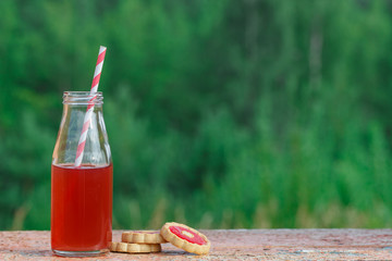 closeup of a red detox drink with a red drinking straw