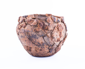 Prehistoric iron pot on a white background