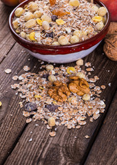 rolled oats in bowl and muesli ingredients