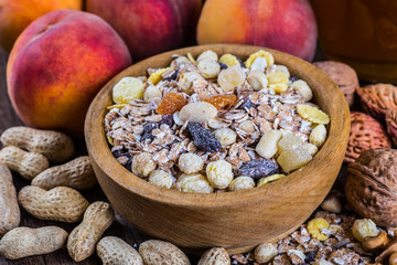 rolled oats in bowl and muesli ingredients