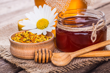 Still life with honey, honeycomb, pollen and propolis