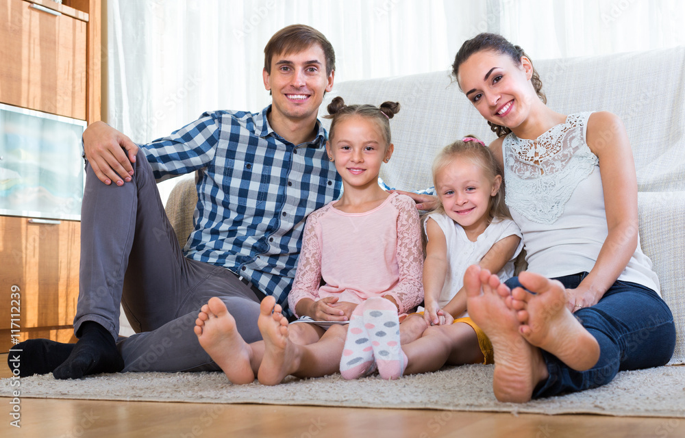 Wall mural portrait of family with kids at home