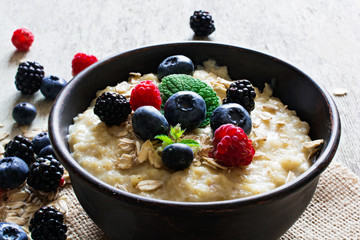 oatmeal porridge with fresh ripe berries