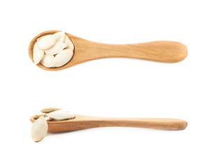 Wooden spoon full of pumpkin seeds