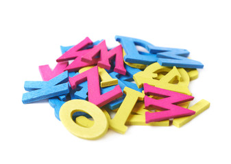 Fototapeta premium Pile of painted wooden letters isolated