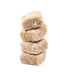 Pile of brown sugar cubes isolated