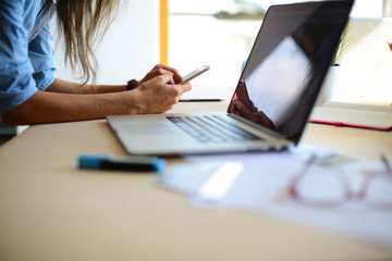 Young female businesswoman in the office