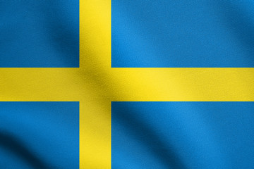 Flag of Sweden waving in wind with fabric texture