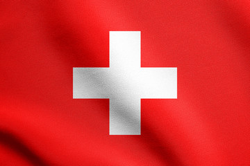 Fototapeta premium Flag of Switzerland waving with fabric texture