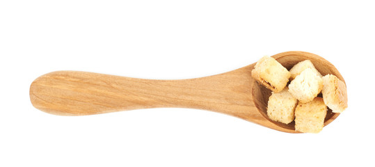 Spoon full of croutons isolated