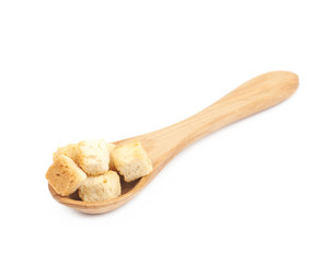 Spoon full of croutons isolated