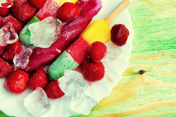 Fruit ice cream and fresh fruits, on a wooden abstract backgroun