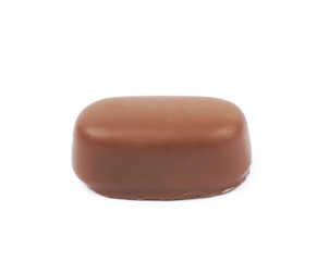 Chocolate coated toffee candy isolated