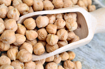 Wooden scoop with chick peas