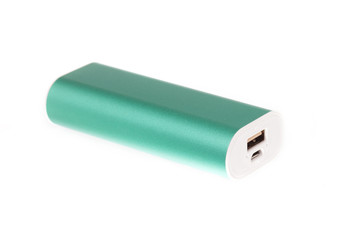 Portable power bank for charging smartphone and tablet on white