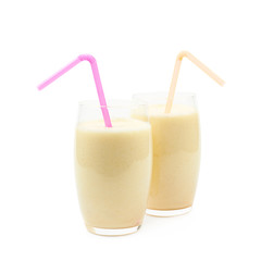 Two glasses of milkshake isolated