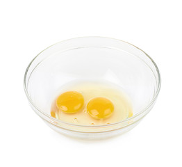 Two cracked eggs in a bowl isolated