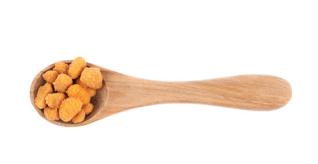 Spoon filled with the breaded peanuts