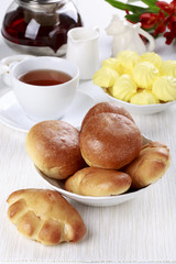 Tea party with buns and meringue cookies.