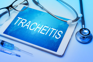 Tracheitis word on tablet screen with medical equipment on background