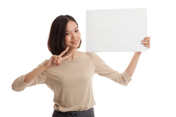 Young Asian business woman show victory sign with blank sign