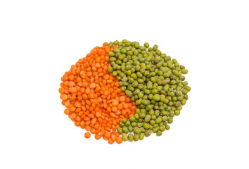 Pile of red and green lentils on a light background