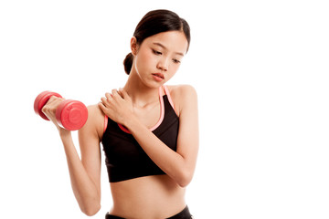Fototapeta na wymiar Asian healthy girl got shoulder pain with dumbbell