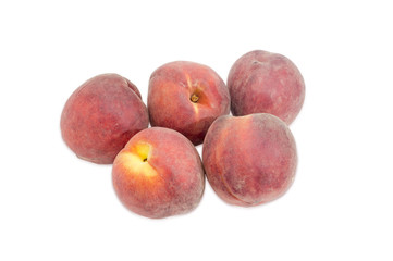 Several peaches on a light background