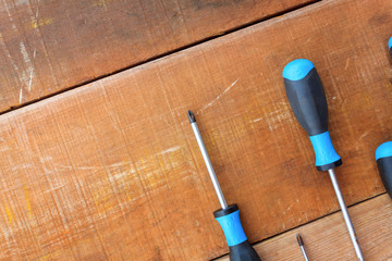 Top view the Phillips screwdriver flat screwdriver on wood background,