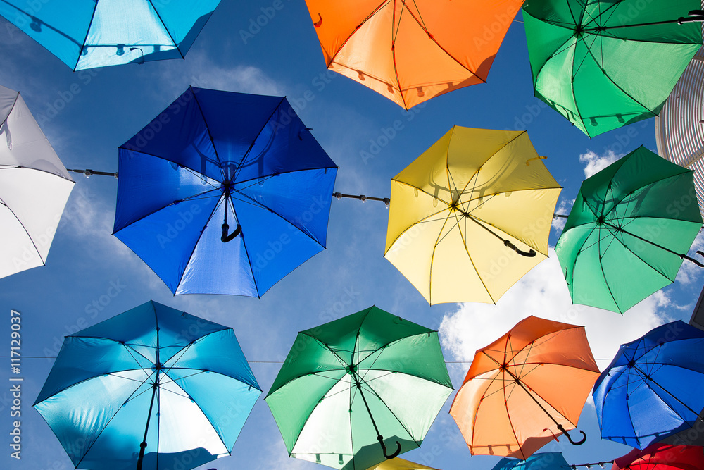 Wall mural colorful umbrellas background