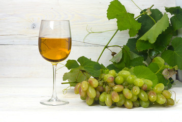 glass of white wine with grapes