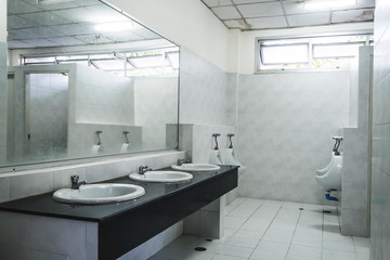 Old dirty interior public restroom