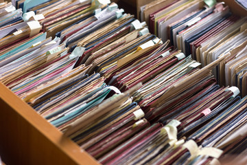 File folders in a file cabinet, card catalog in a library, close