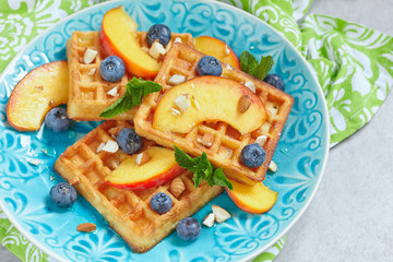 Plate of belgian waffles with fresh berries