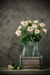 Roses bouquet in rustic vase