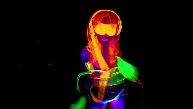 dancer in fluorescent clothing glow