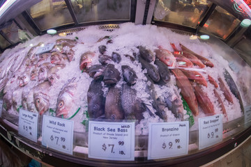 PHILADELPHIA, USA - JUNE 19, 2016 - People buying and eating at city market