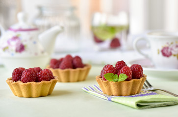 Fruit raspberry tart cakes on a table