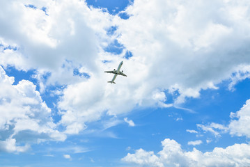Airplane in the sky and cloud at sunrise.
Plane crossing a cloud vignette