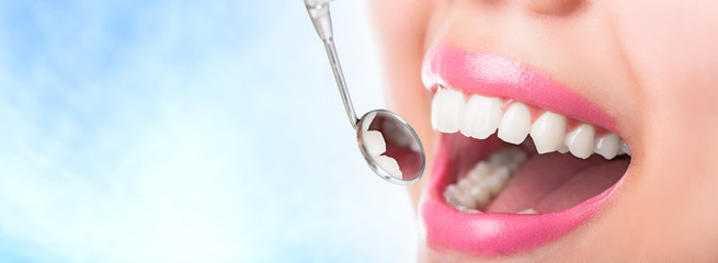 Close up young woman smiling white glamour teeth.