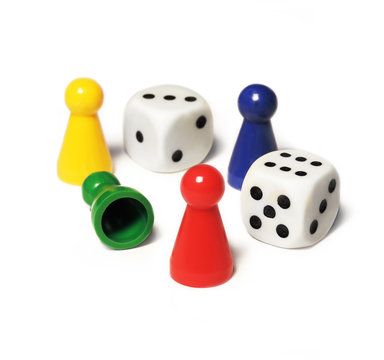 Playing pieces and dice, isolated on white background.