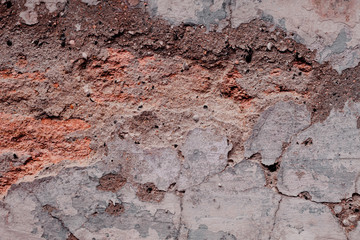 Wall fragment with scratches and cracks