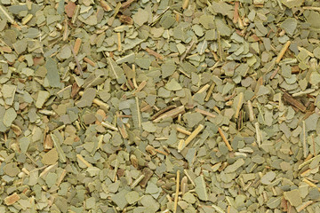 Organic dry Indian bay leaf (Cinnamomum tamala) in big cut size. Macro close up background texture. Top view.