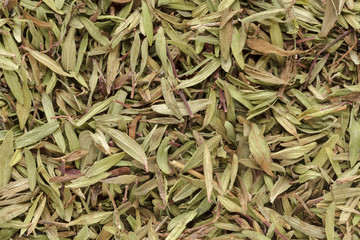 Organic dry (Thymus vulgaris) leaves. Macro close up background texture. Top view.