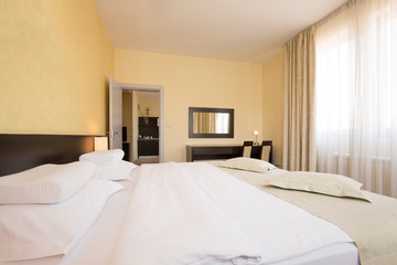 Fototapeta na wymiar Modern elegant hotel bedroom interior
