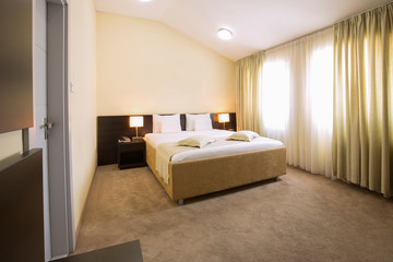 Fototapeta na wymiar Modern elegant hotel bedroom interior