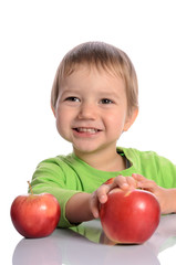 cute child with red apples isolated on white background