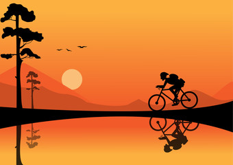 Fototapeta na wymiar young man riding bicycle on sunset backgrounds
