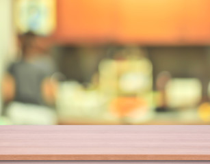 wood kitchen table top with blur kitchen background. 